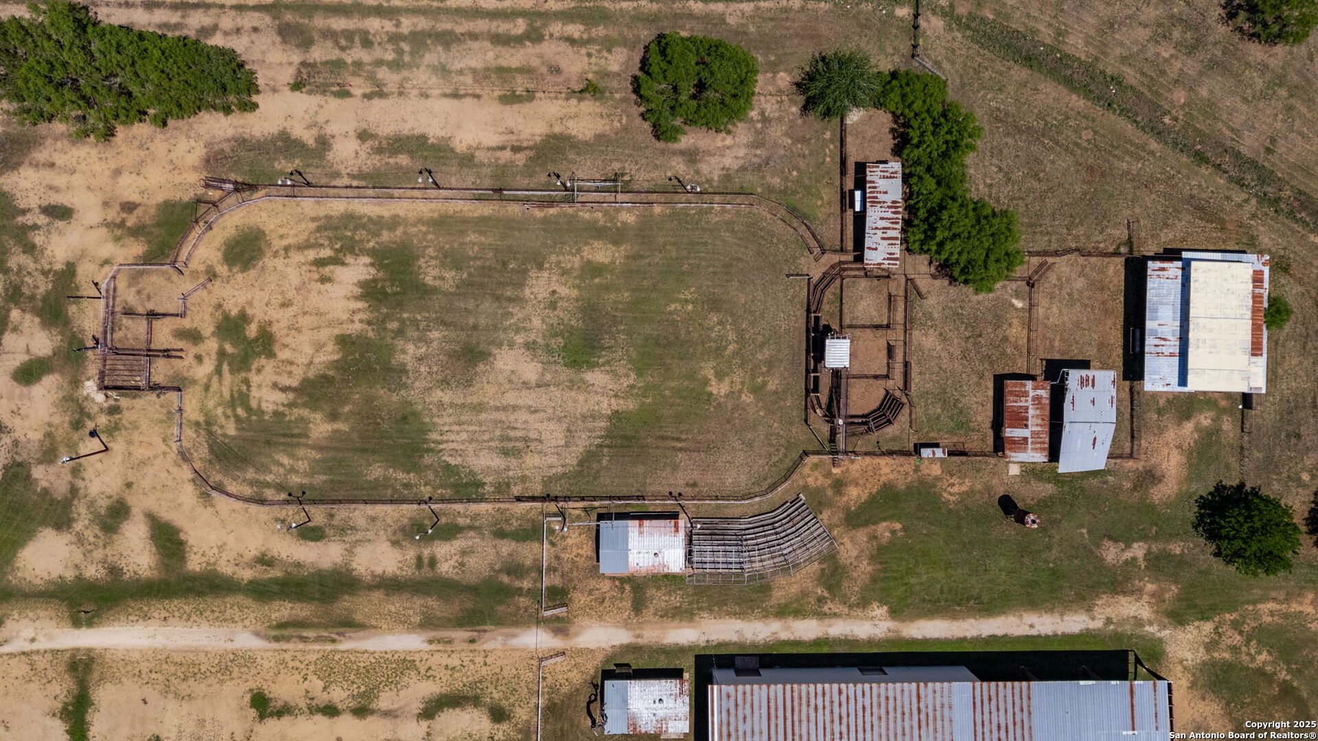 11224 Atkins Road Atascosa, TX 78002 - Photo 24 of 45 an aerial view of residential houses with outdoor space