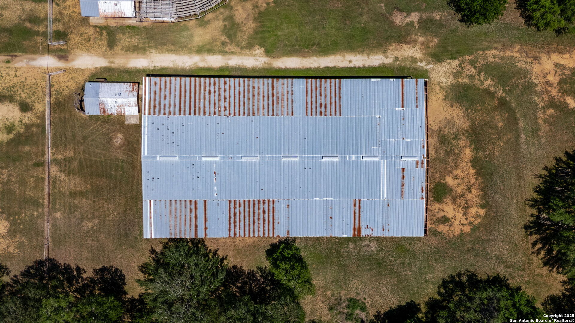 11224 Atkins Road Atascosa, TX 78002 - Photo 25 of 45 an aerial view of a house with a yard