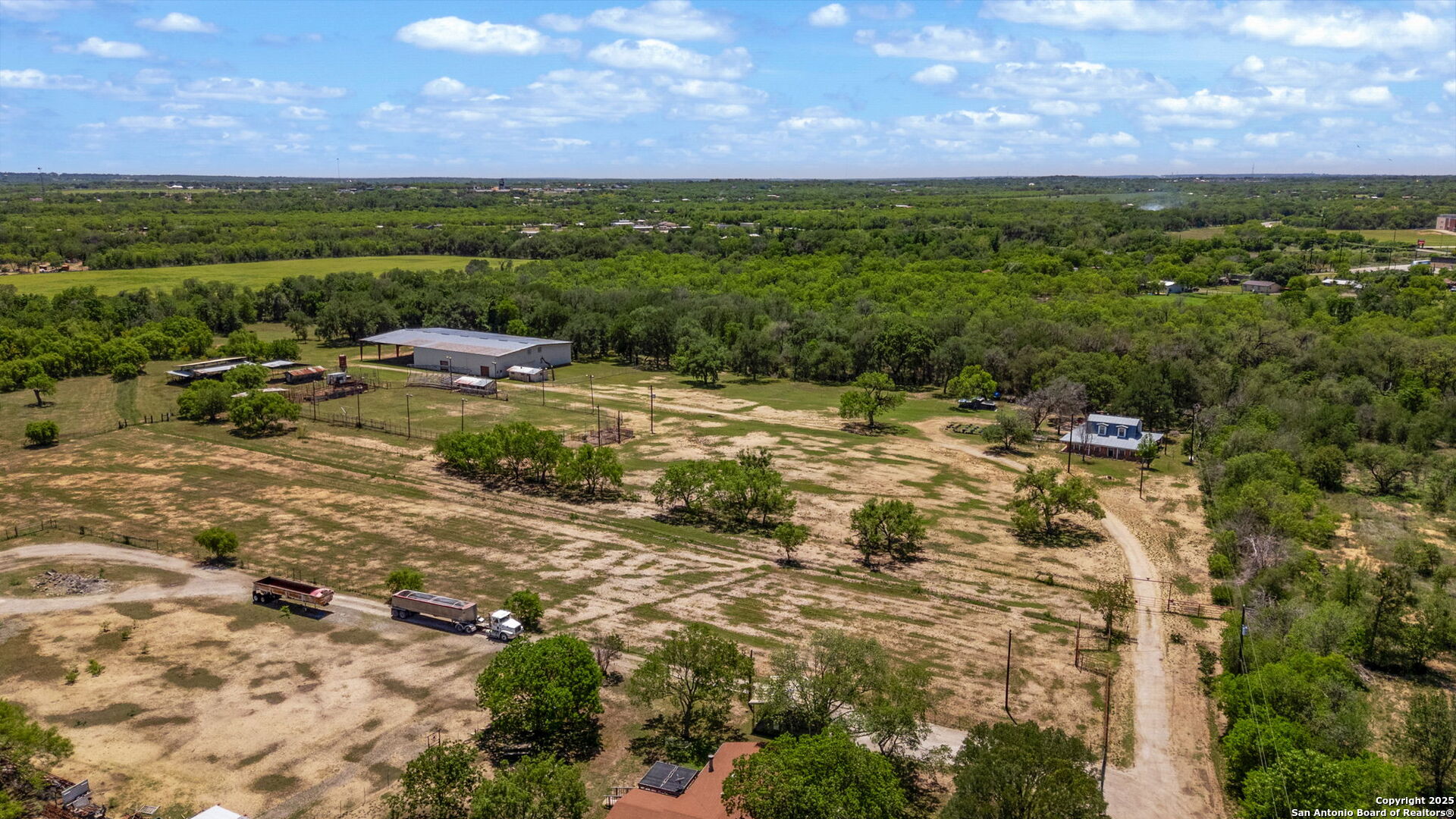 11224 Atkins Road Atascosa, TX 78002 - Photo 3 of 45 a view of a big yard with lots of green space
