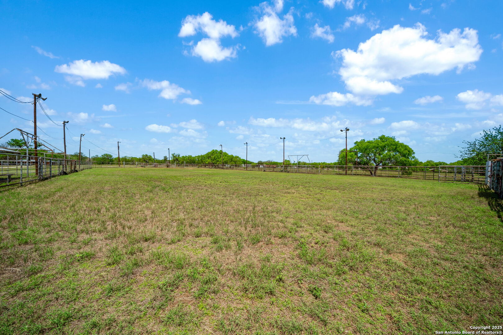 11224 Atkins Road Atascosa, TX 78002 - Photo 31 of 45 a view of a lake with houses in the background