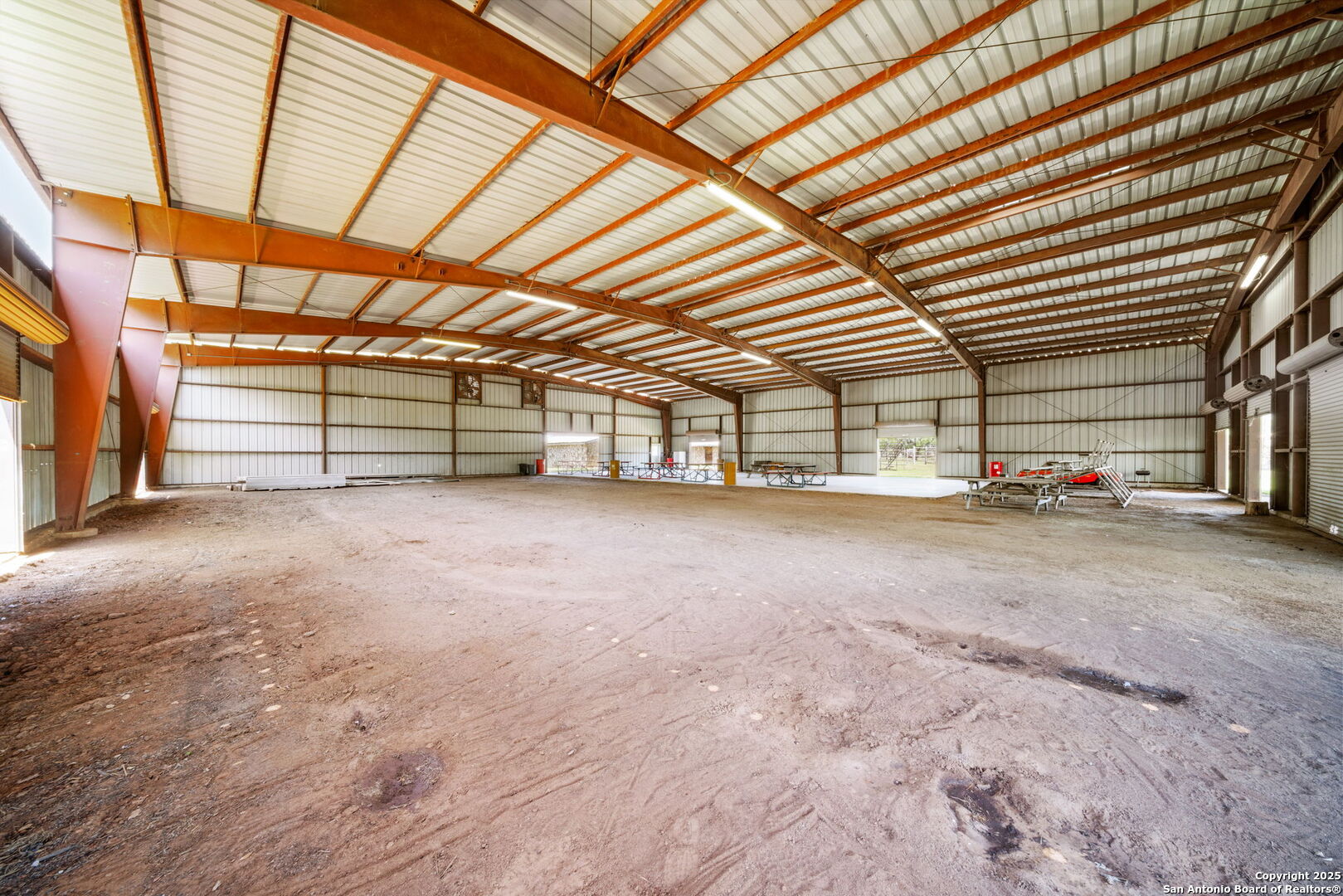 11224 Atkins Road Atascosa, TX 78002 - Photo 43 of 45 a view of a big room with wooden walls