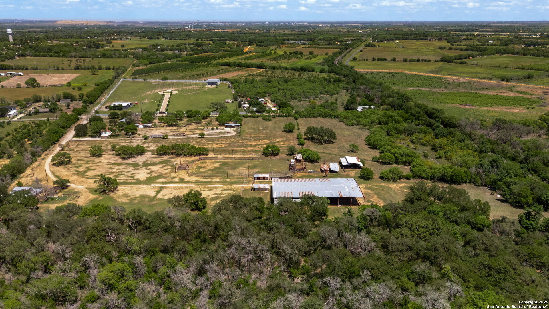 11224 Atkins Road Atascosa, TX 78002 - Photo 8 of 45 a view of a city with mountains in the background