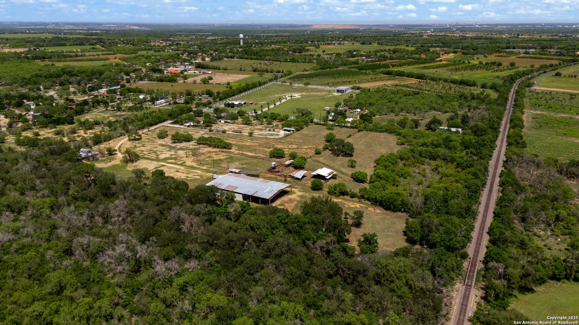 11224 Atkins Road Atascosa, TX 78002 - Photo 9 of 45 an aerial view of residential houses with outdoor space and mountain view