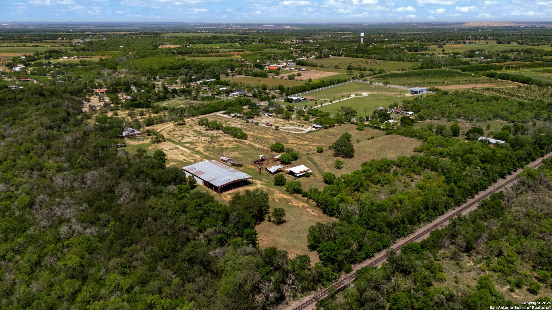 11224 Atkins Road Atascosa, TX 78002 - Photo 10 of 45 an aerial view of residential houses with outdoor space and mountain view