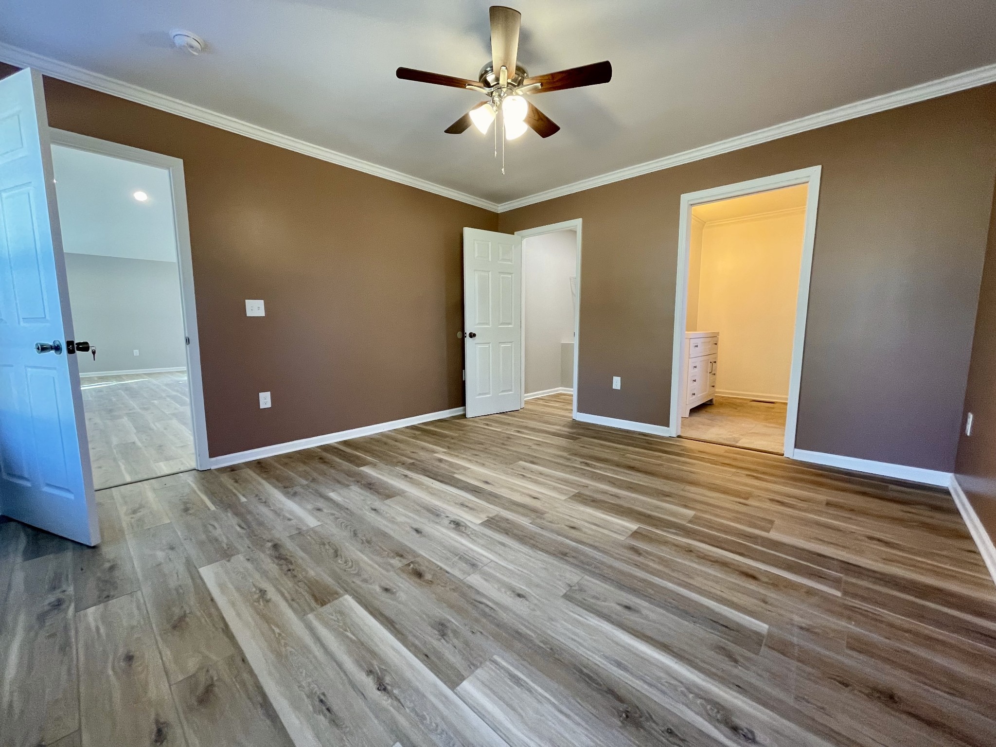 993 Throneberry Road Normandy, TN 37360 - Photo 29 of 56 a view of a room with wooden floor and a ceiling fan
