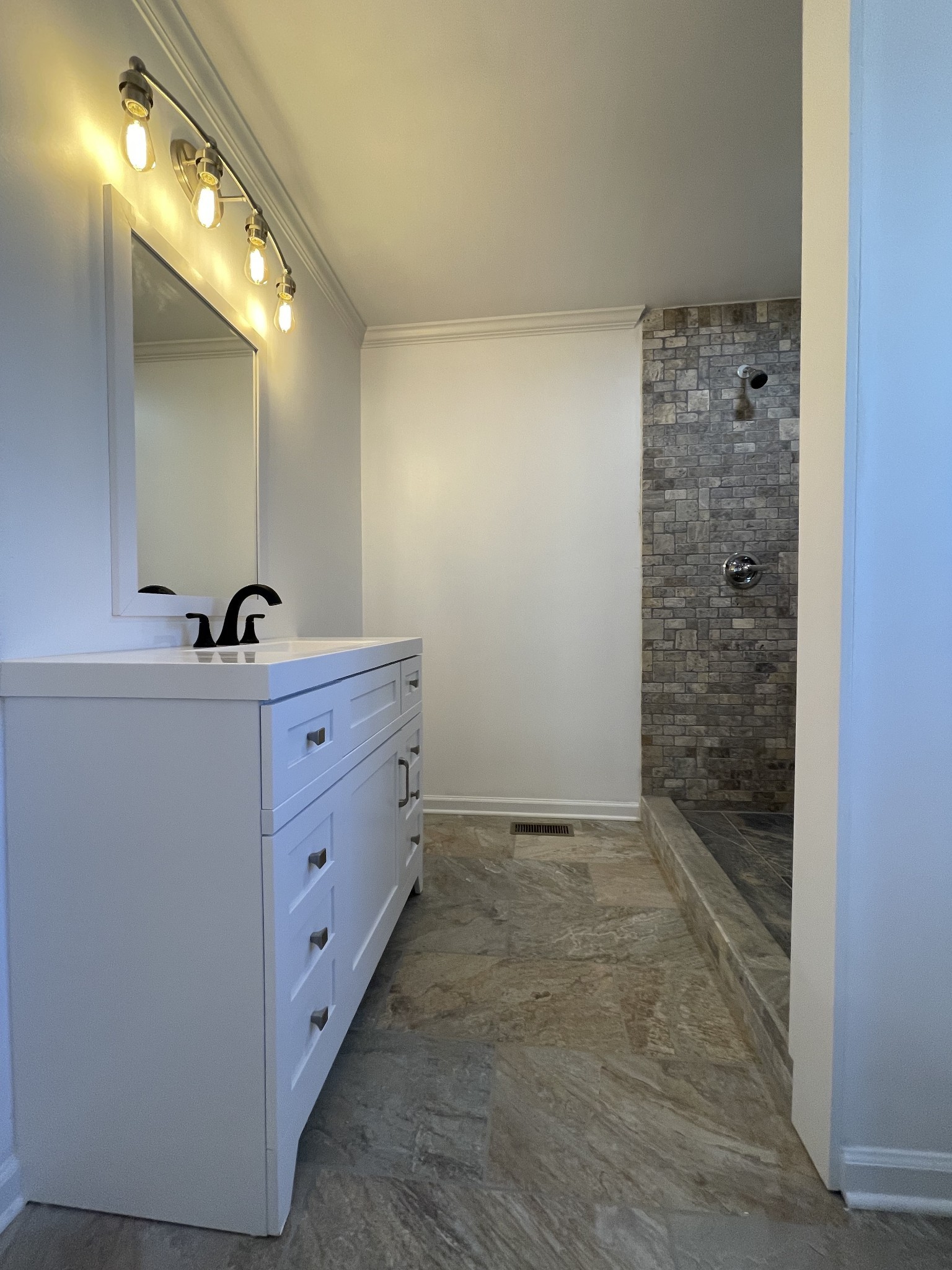 993 Throneberry Road Normandy, TN 37360 - Photo 32 of 56 a bathroom with a double vanity sink and a mirror