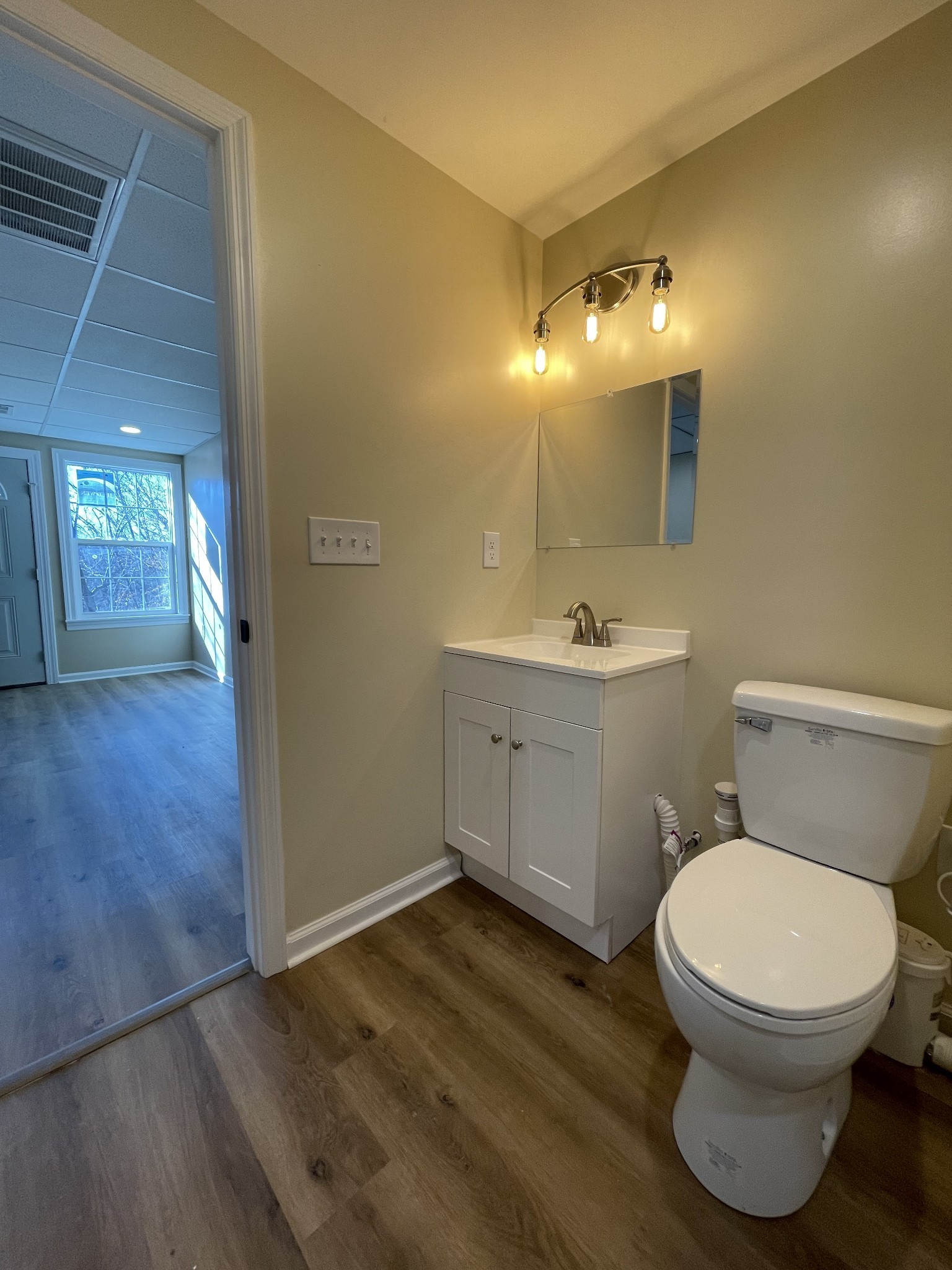 993 Throneberry Road Normandy, TN 37360 - Photo 41 of 56 a bathroom with a toilet sink and mirror