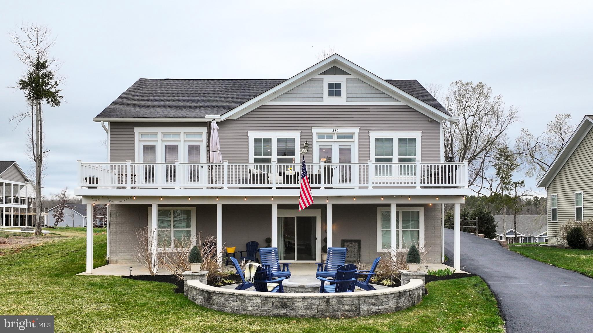 287 Sunset Loop Mineral, VA 23117 - Photo 106 of 112 a front view of a house with a yard table and chairs