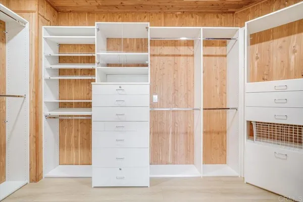 a view of closet area with empty racks