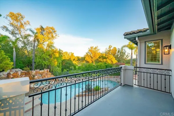 a view of a chairs and table in the balcony