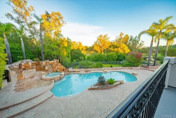 a view of a swimming pool with a patio
