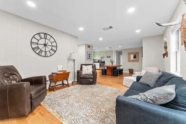 a living room with furniture and a table