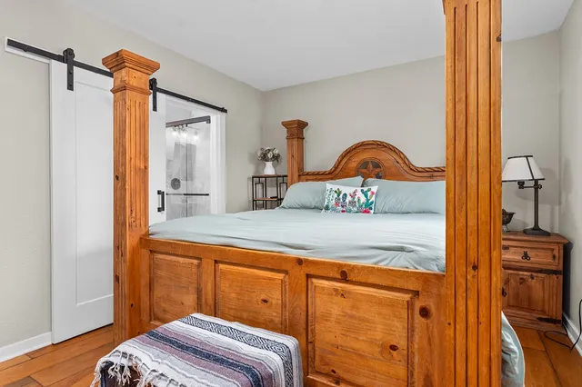 a bedroom with a bed and a dresser