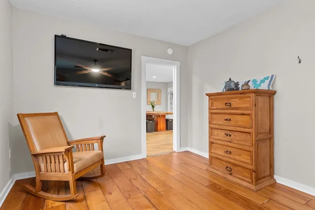 a view of a livingroom with furniture and wooden floor