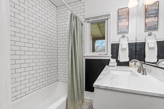 a bathroom with a sink and a bathtub