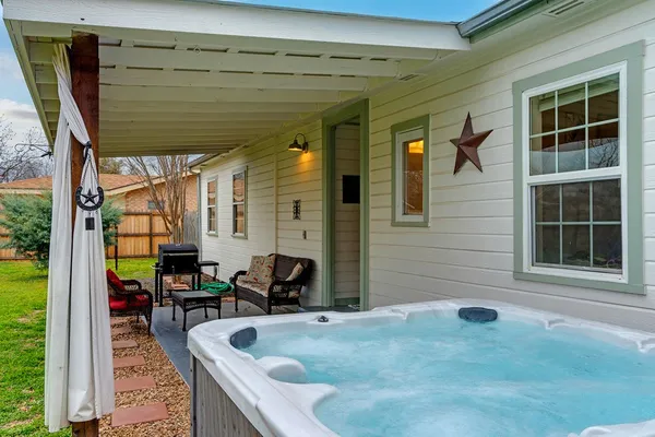 a view of swimming pool with outdoor seating