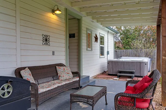 a outdoor living space with furniture and a fireplace