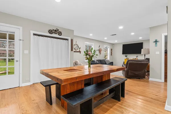 a view of a dining room with furniture window and wooden floor