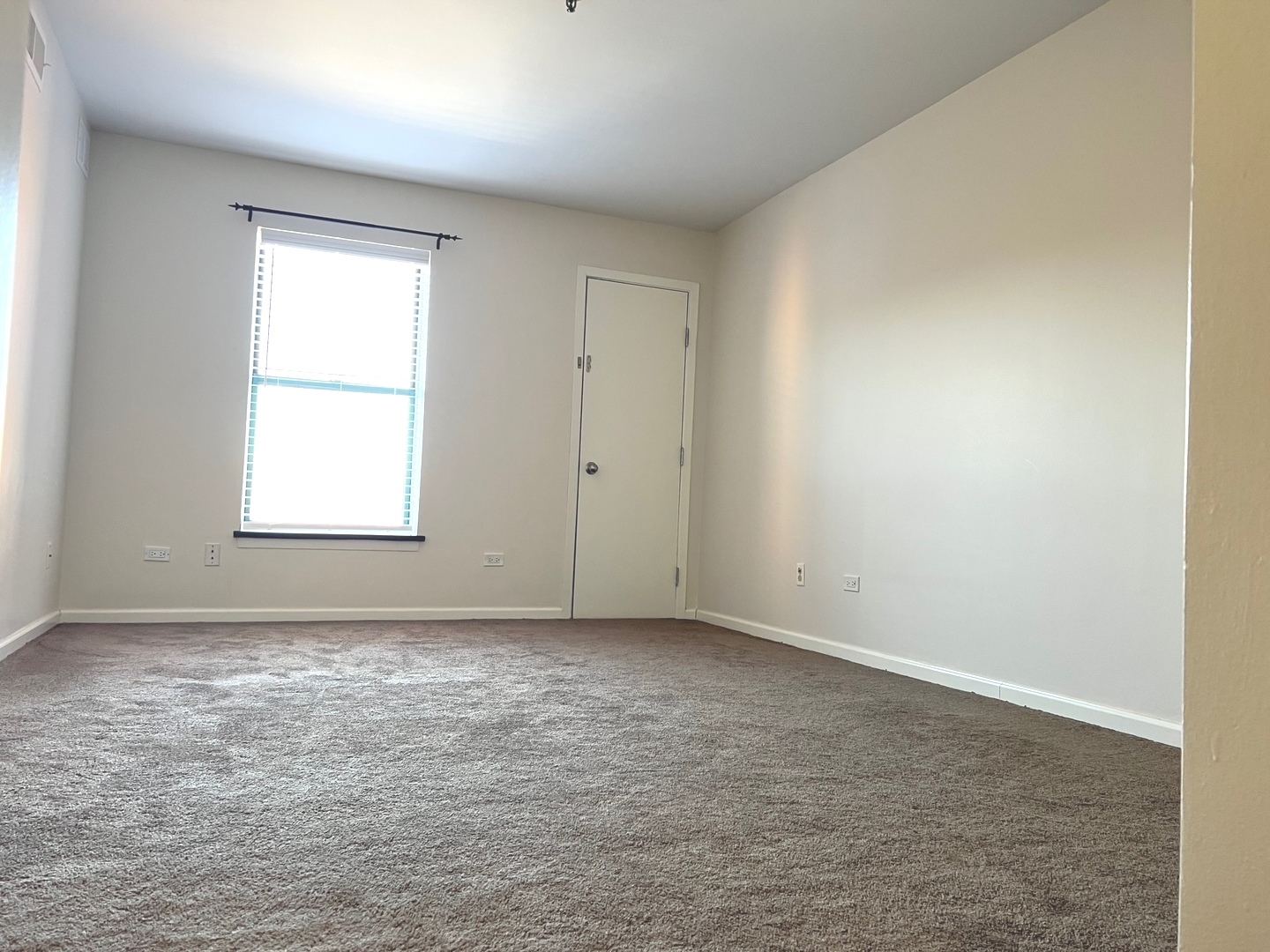 3255 Kirchoff Road, Unit 312 Rolling Meadows, IL 60008 - Photo 9 of 12 an empty room with a window