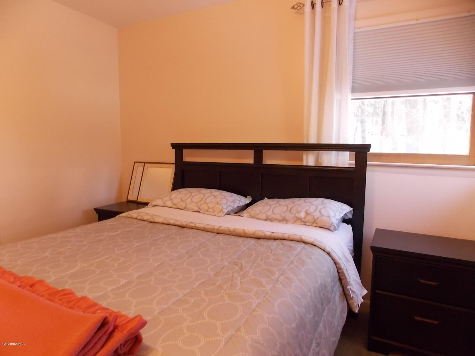 21 Lake Rd Extension Richmond, MA 01201 - Photo 14 of 44 a bed sitting in a bedroom next to a window