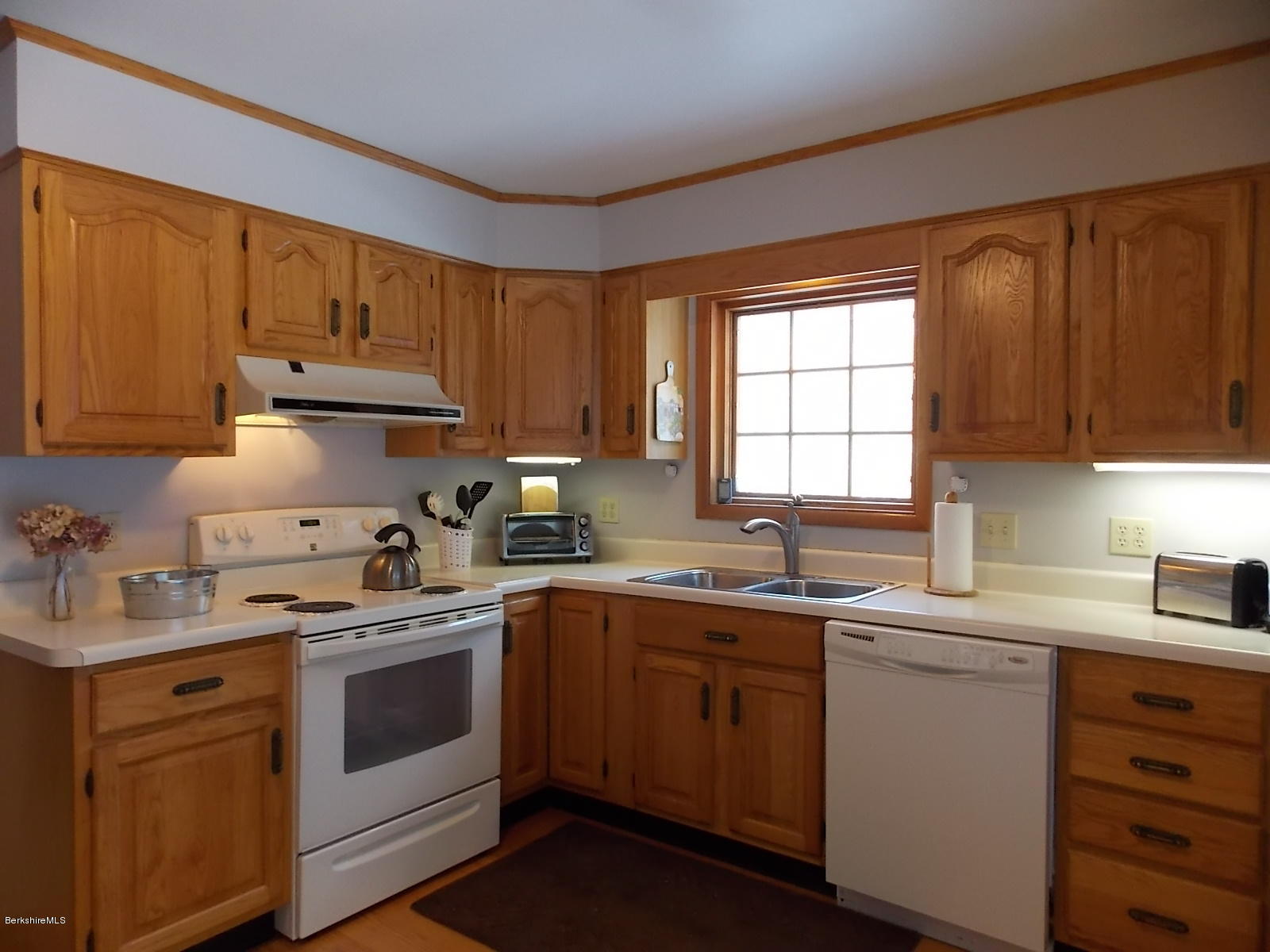 21 Lake Rd Extension Richmond, MA 01201 - Photo 3 of 44 a kitchen with a sink stove and cabinets
