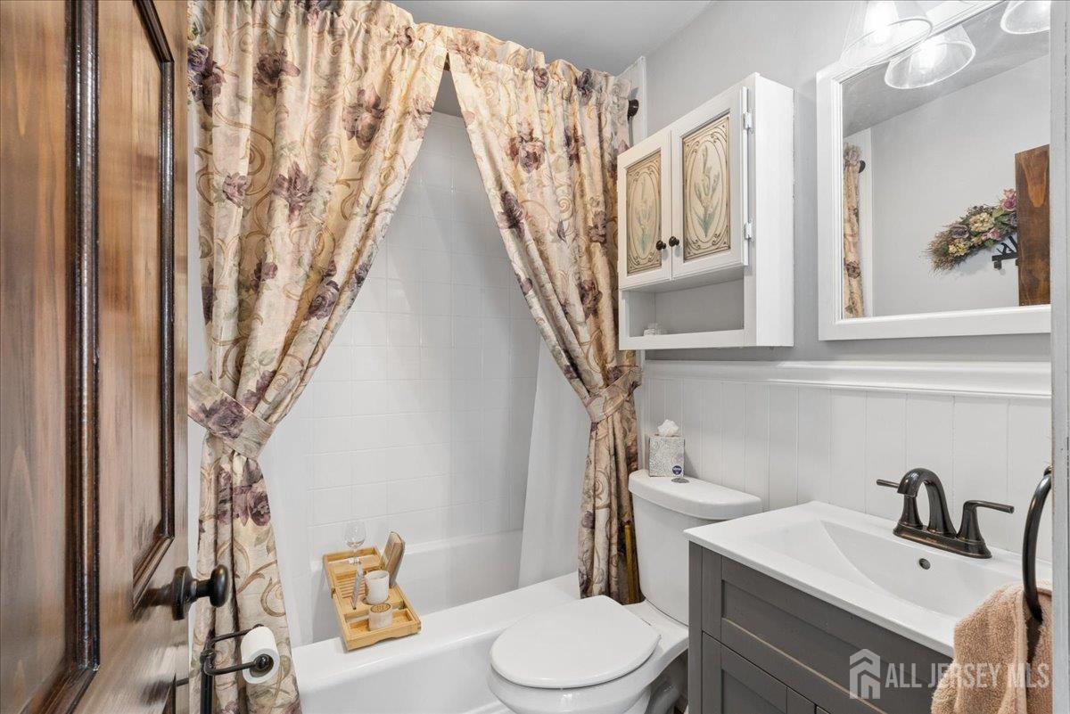 45 Walnut Street Edison, NJ 08817 - Photo 17 of 28 a bathroom with a sink a toilet and a mirror
