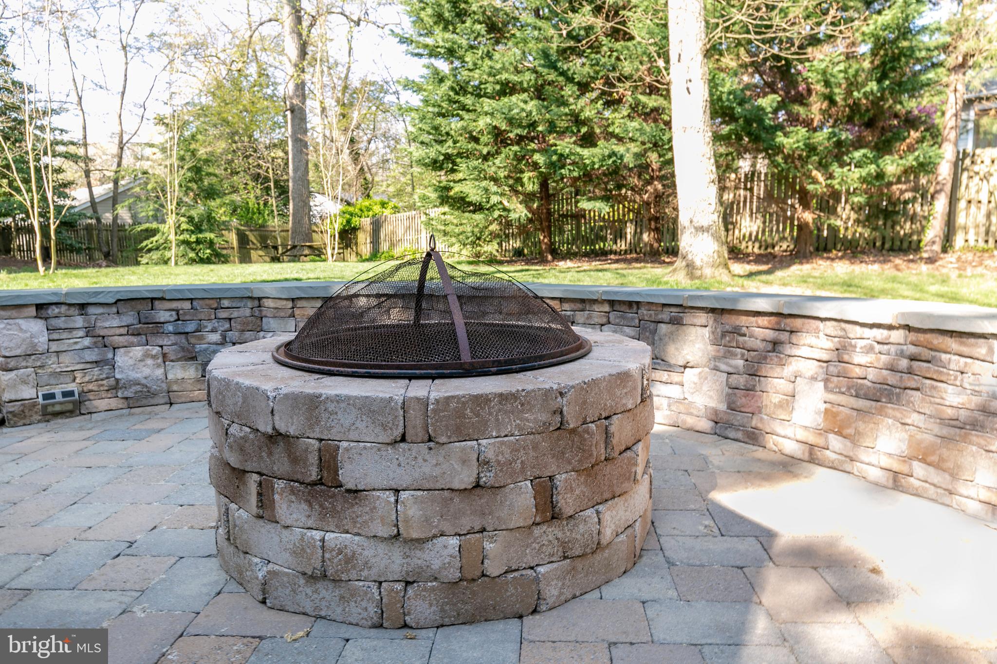 1021 Old Bay Ridge Road Annapolis, MD 21403 - Photo 29 of 42 Stone Firepit and Retaining Wall