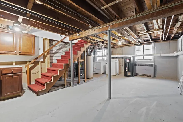 a view of storage and utility room with stairs
