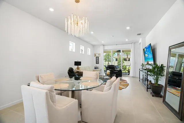 a kitchen with a refrigerator a stove a sink dishwasher and a refrigerator with wooden floor