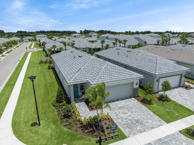 a aerial view of a house with a yard