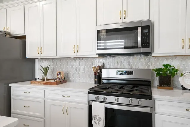 a bedroom that has a bed and a desk in it