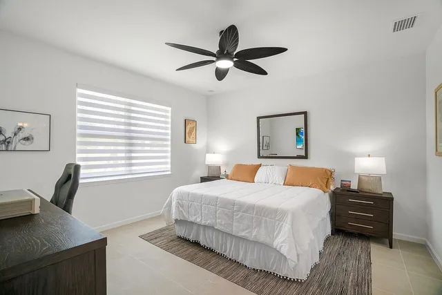 a bedroom with a workspace