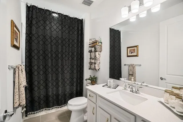 a view of a chairs and table in patio with a yard