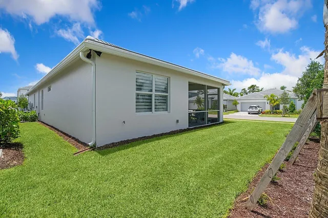 an aerial view of a house with pool lake view and mountain view