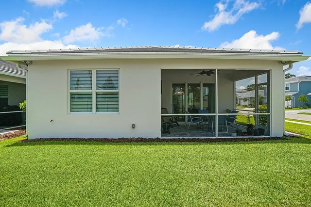 an aerial view of a house with a ocean view