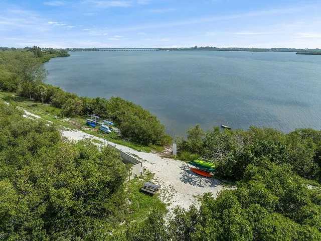 a ocean view with beach and green space