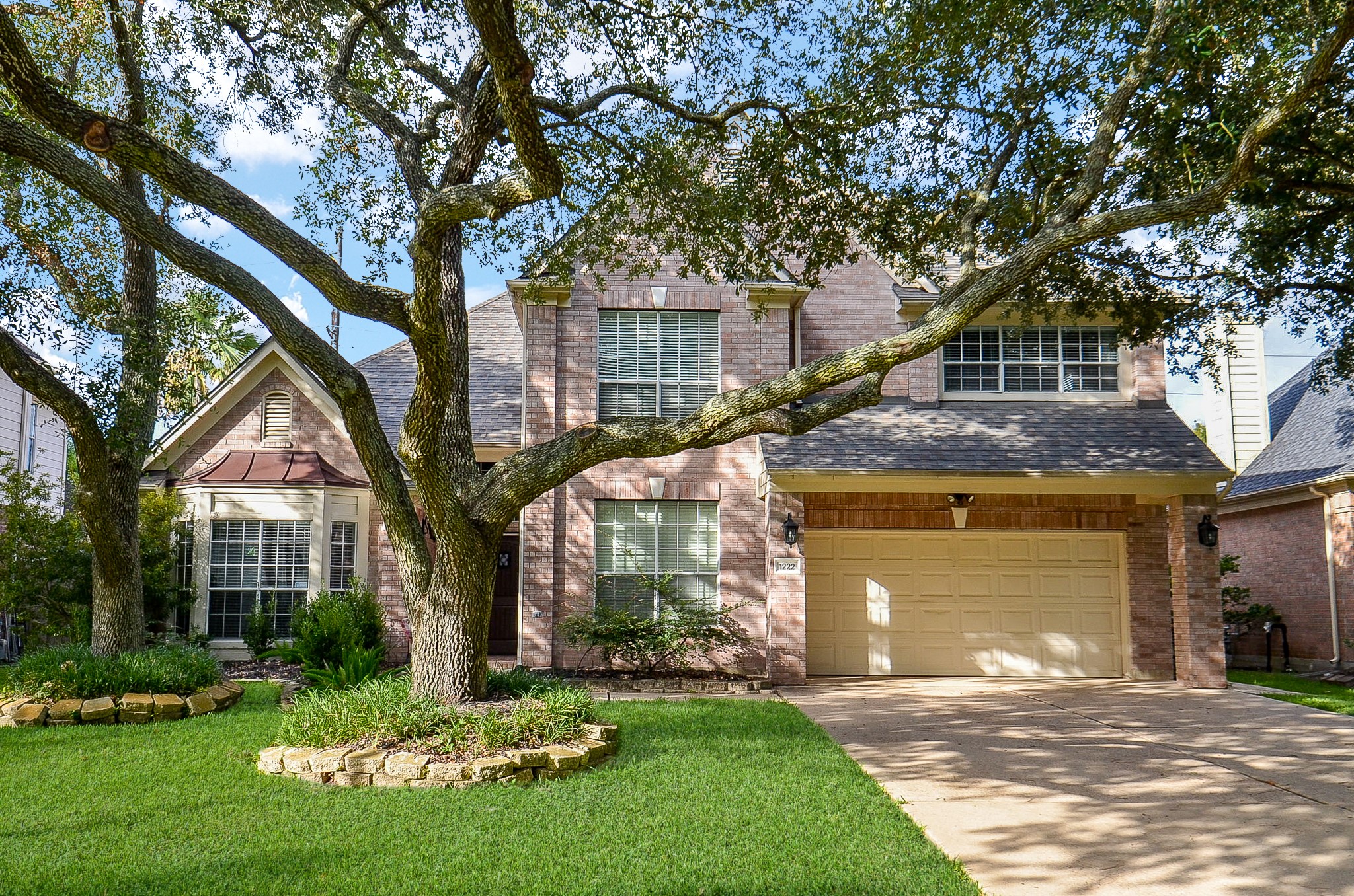 1222 Ragsdale Lane Katy, TX 77494 - Photo 2 of 31 Two car oversized garage, double driveway and partial porte cochere provide ample parking for family and guests.