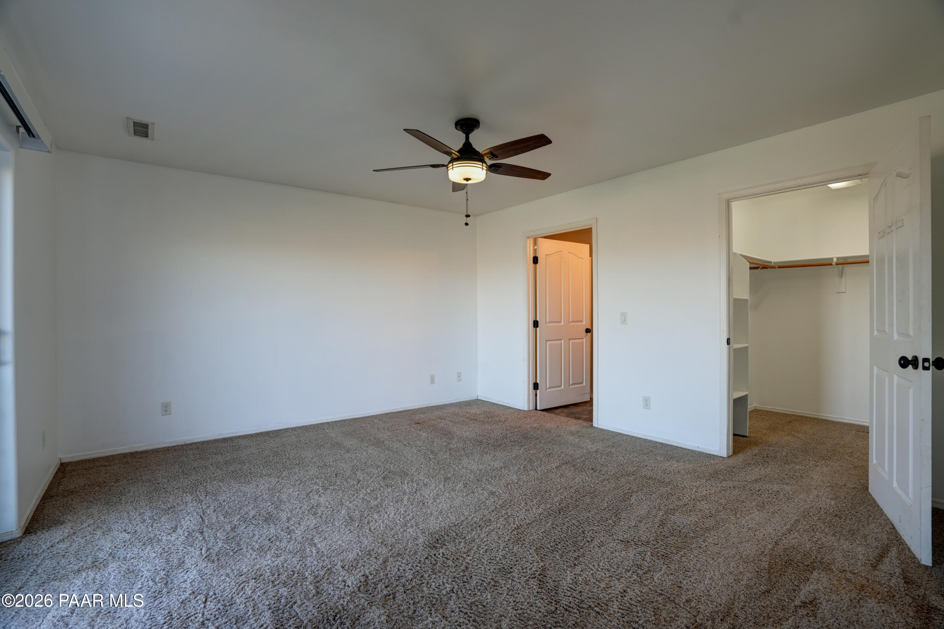 200 North Outback Road Dewey, AZ 86327 - Photo 12 of 34 an empty room with closet and a ceiling fan