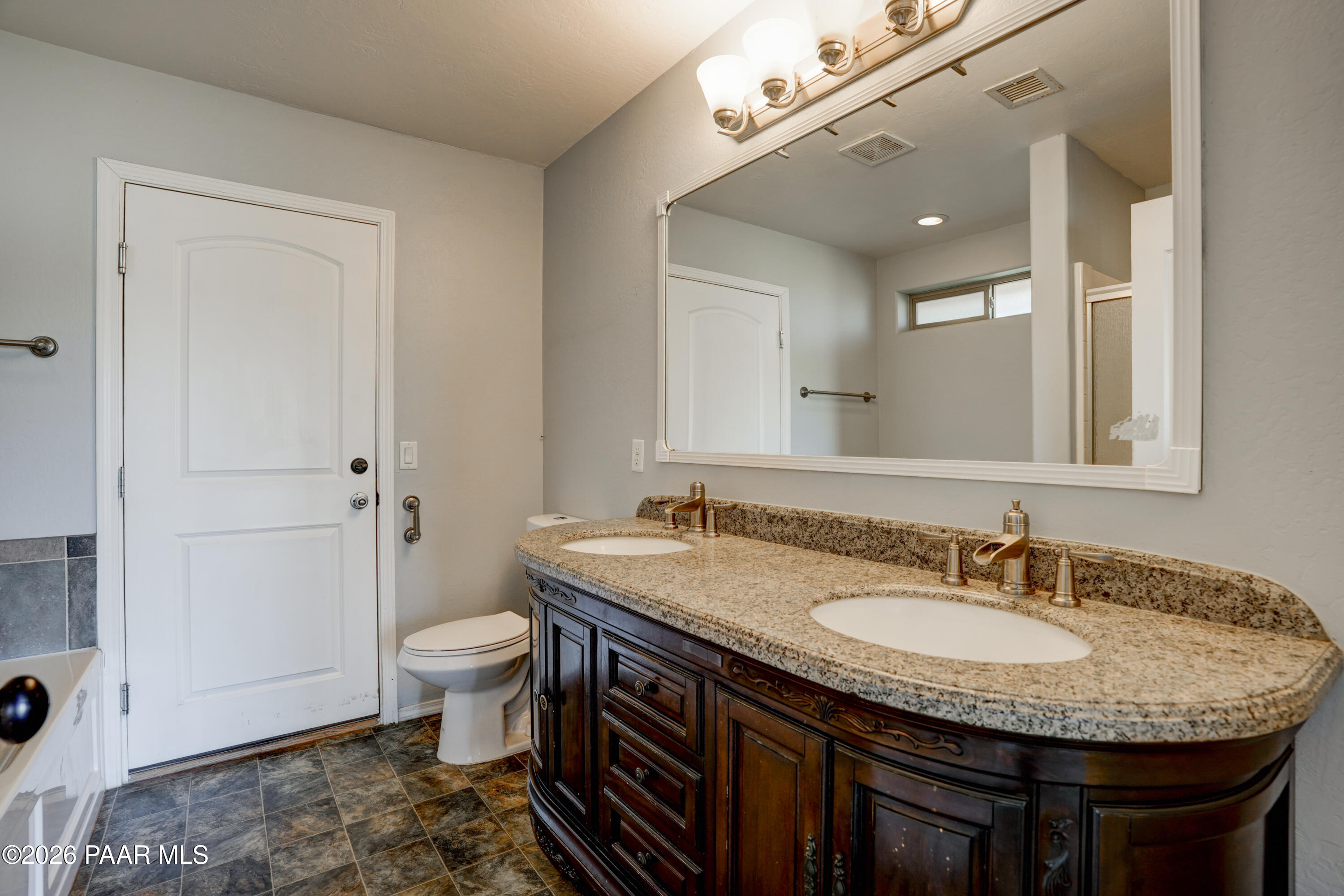 200 North Outback Road Dewey, AZ 86327 - Photo 14 of 34 a bathroom with a granite countertop sink a toilet and a mirror