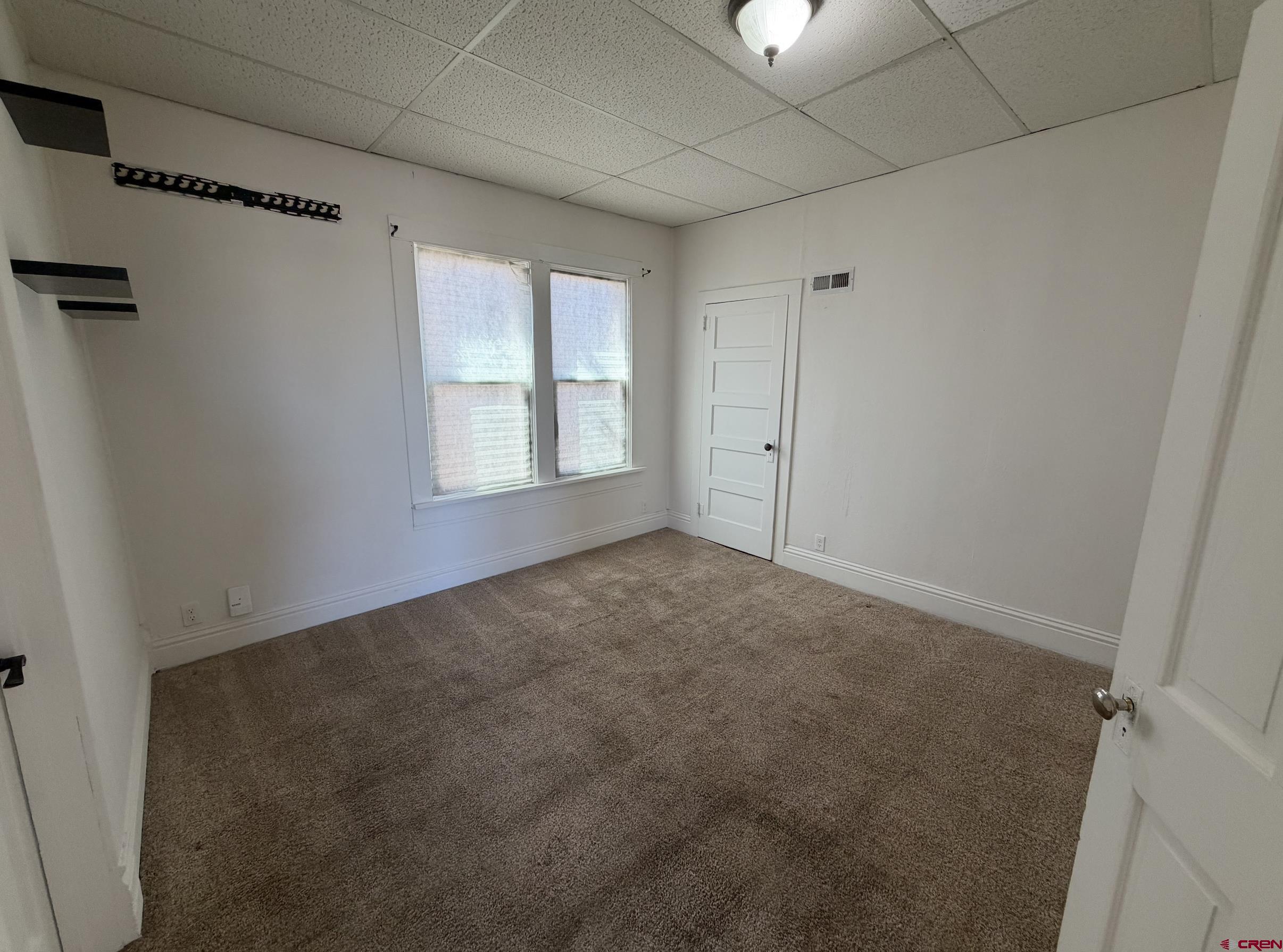1001 Main Street Delta, CO 81416 - Photo 12 of 29 a view of an empty room with a window