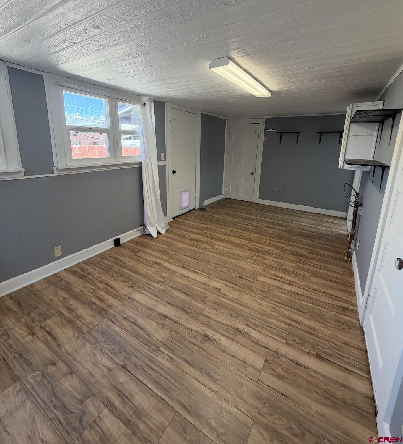 1001 Main Street Delta, CO 81416 - Photo 19 of 29 a room with a bed and a window
