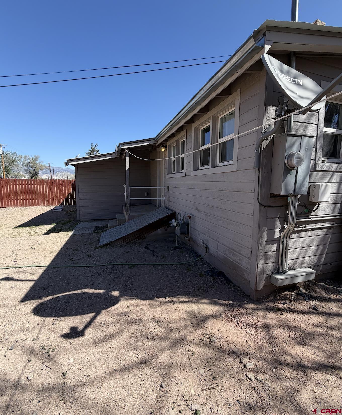 1001 Main Street Delta, CO 81416 - Photo 22 of 29 a black car parked in front of a house