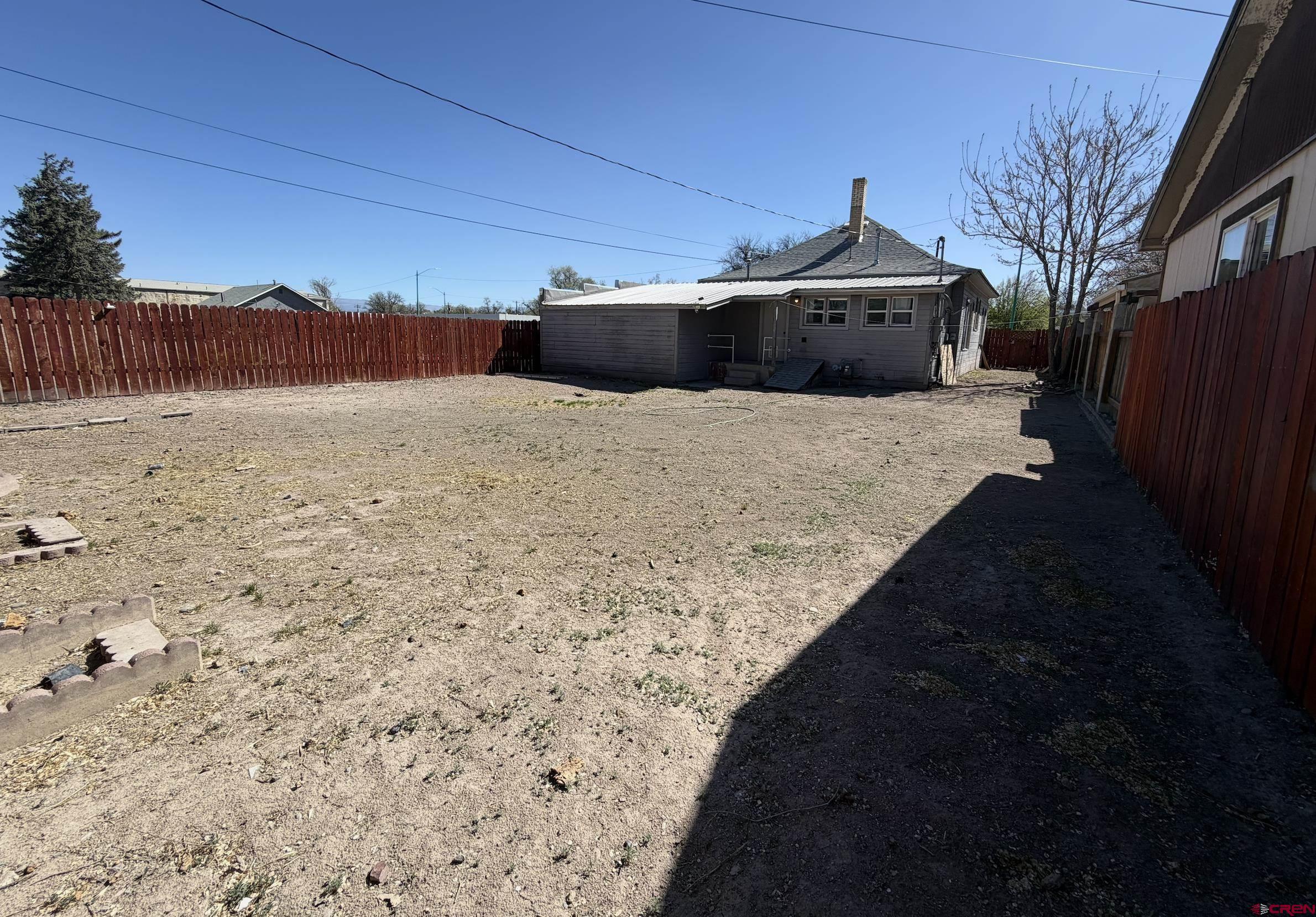 1001 Main Street Delta, CO 81416 - Photo 23 of 29 a front view of a house with a yard