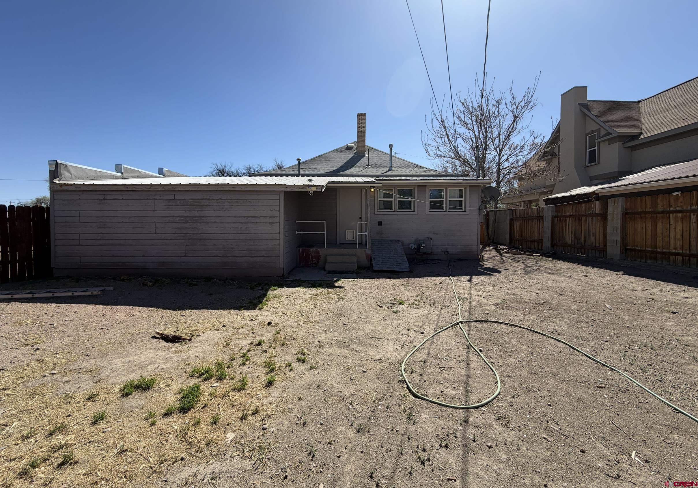 1001 Main Street Delta, CO 81416 - Photo 26 of 29 a view of a house with a snow in the yard