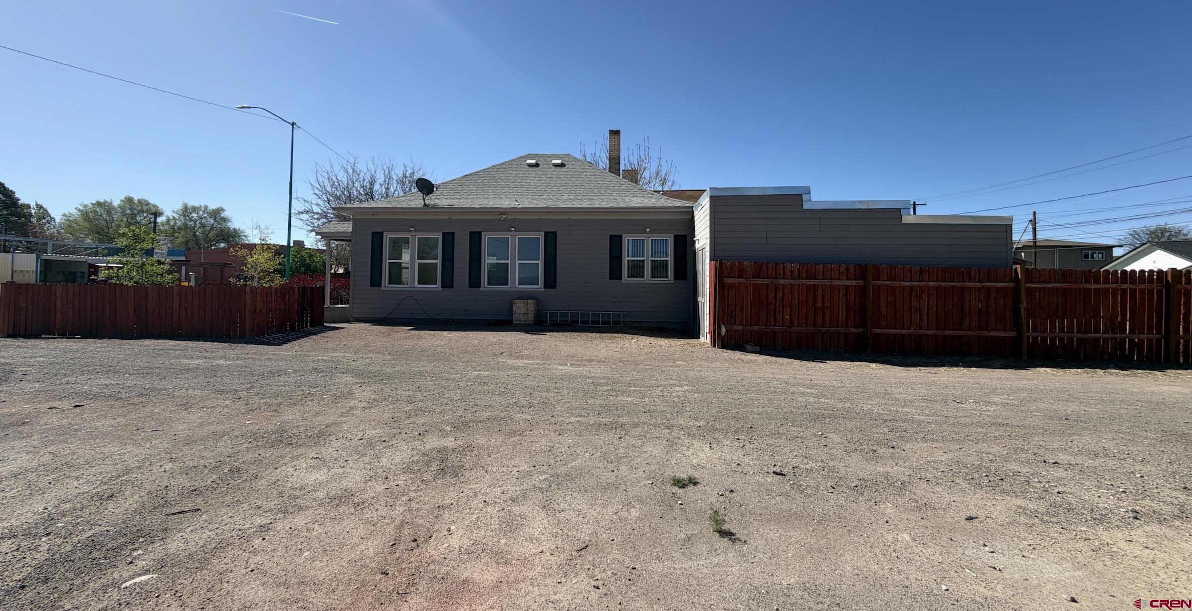 1001 Main Street Delta, CO 81416 - Photo 27 of 29 a front view of a house with a yard
