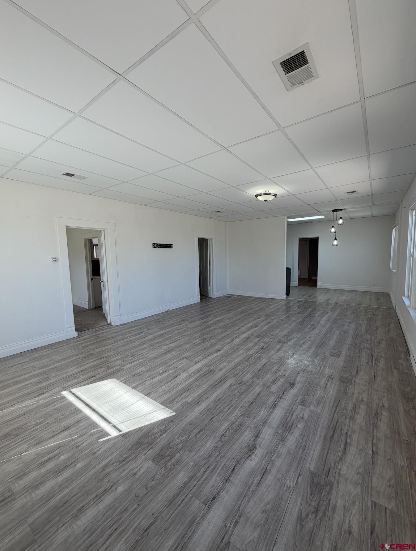 1001 Main Street Delta, CO 81416 - Photo 5 of 29 a view of a livingroom with wooden floor