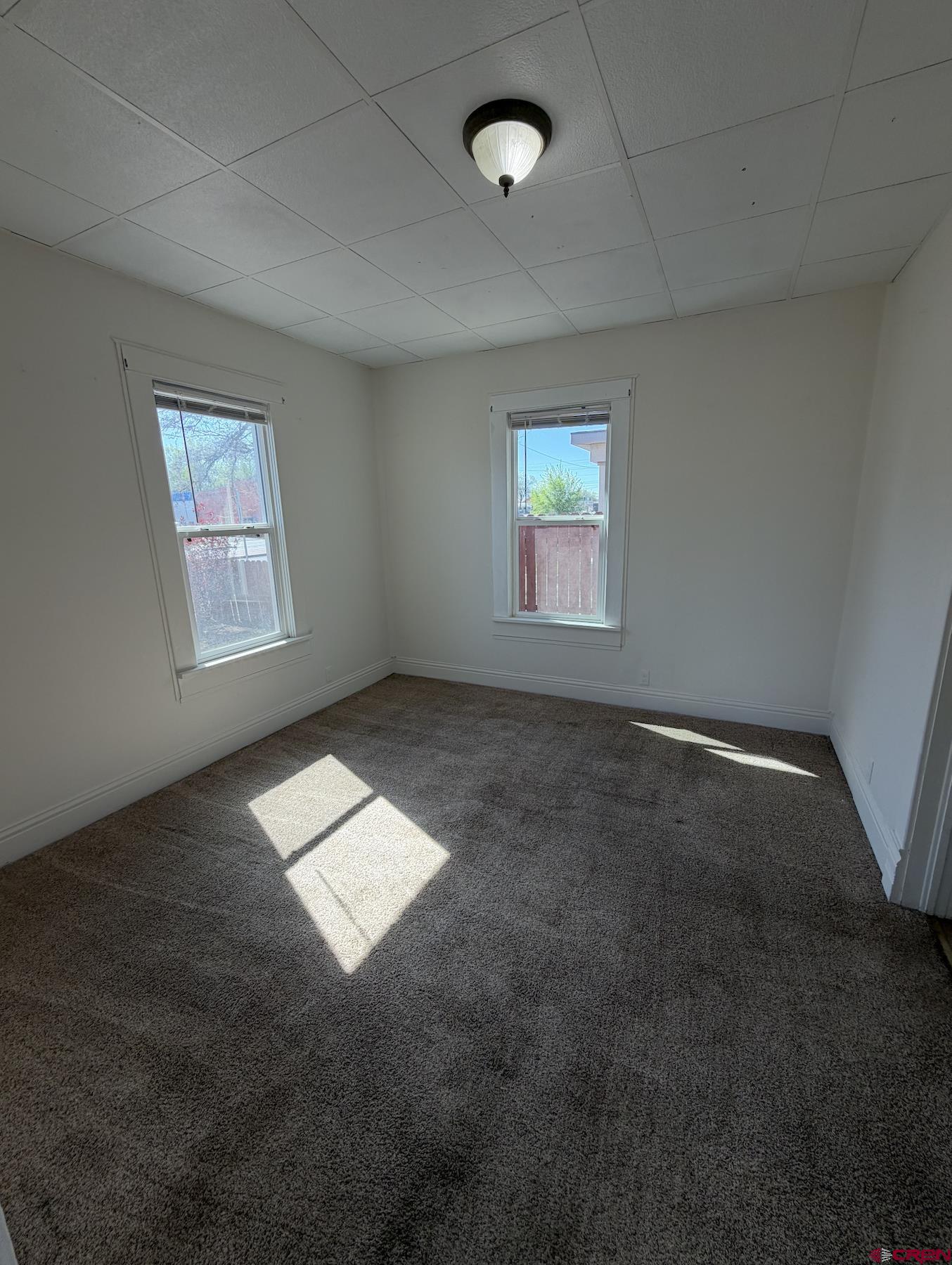 1001 Main Street Delta, CO 81416 - Photo 7 of 29 an empty room with windows