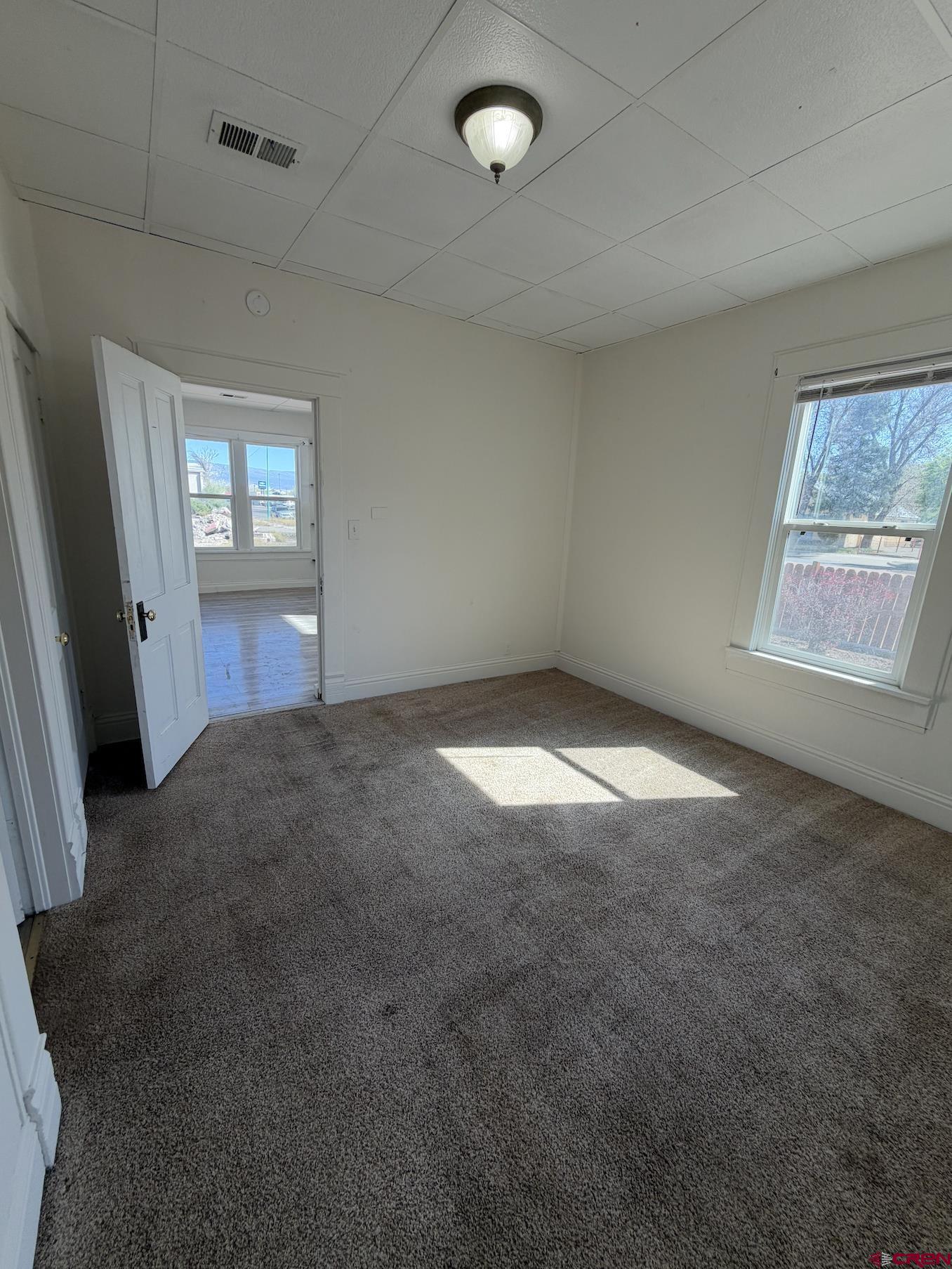 1001 Main Street Delta, CO 81416 - Photo 8 of 29 an empty room with windows