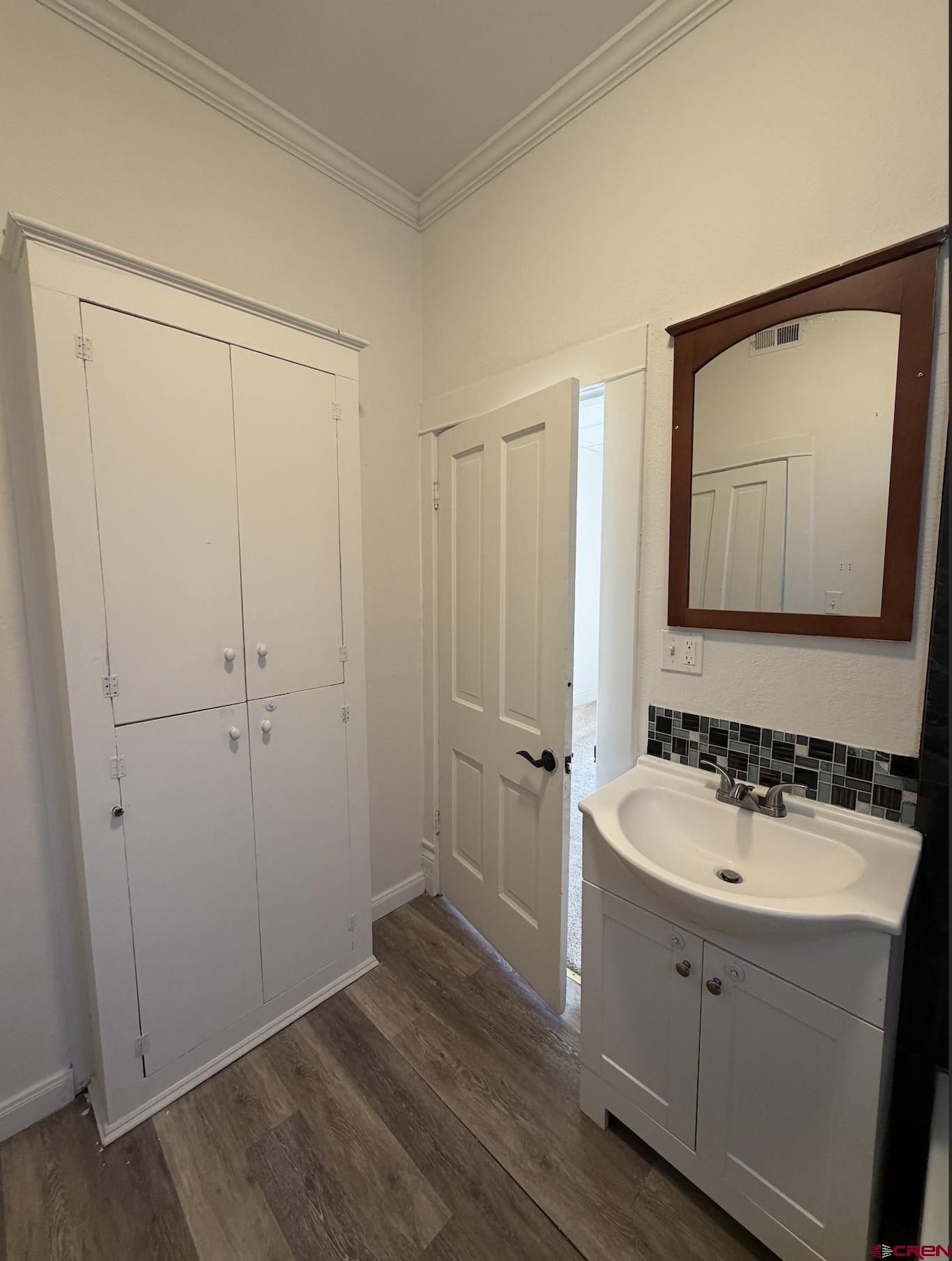 1001 Main Street Delta, CO 81416 - Photo 10 of 29 a bathroom with a sink and a mirror