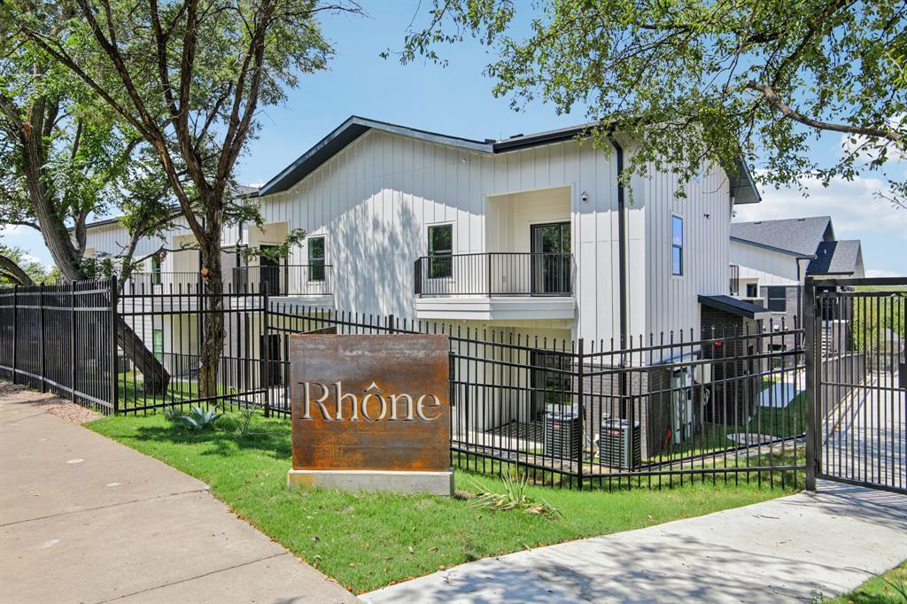 2450 Wickersham Lane, Unit 1927 Austin, TX 78741 - Photo 1 of 40 a front view of a house with a yard